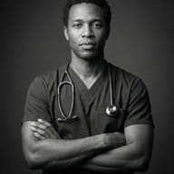 Medical Professional in Scrubs AI Photo Editing Prompt. AI generated black and white studio portrait of a Black male medical professional wearing scrubs and a stethoscope with his arms crossed.