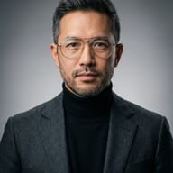 Corporate Man with Glasses AI Photo Editing Prompt. AI generated studio portrait of a bearded man wearing wire-rimmed glasses, a black turtleneck, and a dark grey blazer.
