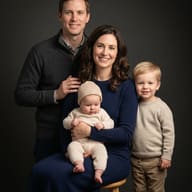 AI generated studio portrait of a smiling family of four in cozy knitwear against a dark backdrop with soft lighting.
