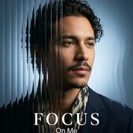 AI generated cinematic portrait of a man with wavy hair and a patterned scarf, partially obscured by vertical glass distortion with "FOCUS On Me" text overlay.