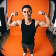 AI generated fisheye studio portrait of a smiling man in a black tank top flexing his biceps against a bright orange backdrop.