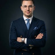 AI generated studio portrait of a man with glasses wearing a navy blue double-breasted suit with arms crossed.