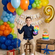 Boy's 9th Birthday Rainbow Celebration AI Photo Editing Prompt. AI generated studio portrait of a smiling boy sitting on a stool surrounded by colorful balloons, a rainbow cake, and birthday gifts.